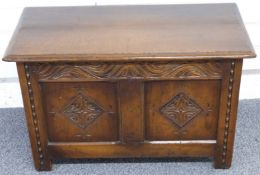 A small oak coffer with carved decoration, W77 x D38 x H48cm