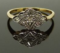 An 18ct gold ring set with diamonds in a platinum setting, size N, 2.10g