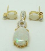 A 9ct gold pendant set with an opal cabochon and zircon and a pair of 9ct gold earrings set with