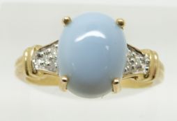 A 9ct gold ring set with a opal cut blue fire opal cabochon and diamonds, 2.9g, size N