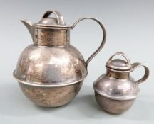 Two hallmarked silver Guernsey cream jugs, one Birmingham 1964 height 8cm the other smaller