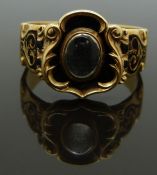 Victorian 18ct gold mourning ring set with a central glass compartment surrounded by black enamel