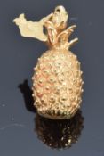 A yellow metal charm/ pendant in the form of a pineapple and Hawaii island, 7.4g