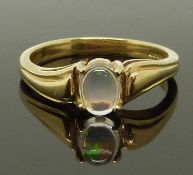 A 9ct gold ring set with an opal, size N, 2.57g