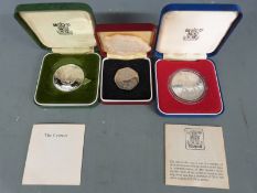 Two Royal Mint commemorative silver cased crowns together with a Common Market 50p
