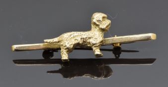 A 9ct gold bar brooch in the form of a Dandie Dinmont dog, 9.3g