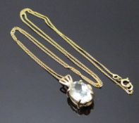 A 9ct gold pedant set with an oval mixed cut aquamarine on a 9ct gold chain, 2.3g
