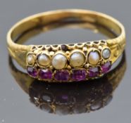 Victorian yellow metal ring set with seed pearls and foiled rubies, size M