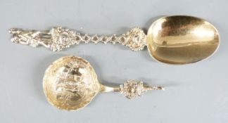 Two Continental gilt white metal spoons, one with embossed decoration to bowl, no visible marks