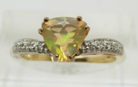 A 9ct gold ring set with a trilliant cut opal and diamonds, 1.7g, size M