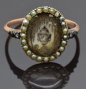 Georgian mourning ring set with an ivory plaque depicting a willow tree and urn surrounded by seed