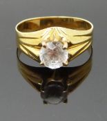 A yellow metal ring set with paste, size Q/R, 3.00g