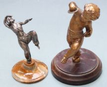 Art Deco silver plated figurine of a dancer together with a gilt metal cherub playing cymbals,