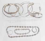 Six silver bangles, two silver rings and a matching silver necklace and bracelet