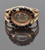 Georgian mourning ring set with plaited hair to the to the central glass compartment surrounded by