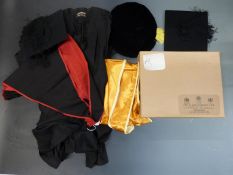 Two cap and gown sets for scholars/graduates, one set in an Ede and Ravenscroft box