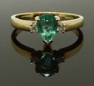 A 9ct gold ring set with a pear cut emerald and diamonds, size N, 2.18g