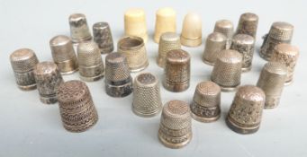 Sixteen various hallmarked silver and white metal thimbles and further thimbles including a mother