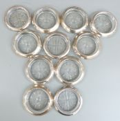 Set of eight white metal mounted glass coasters, each marked Frank Whitting & Co. Sterling, together