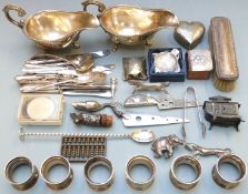 Silver plated items including cutlery, pair of heavy plated gravy boats, napkin rings, hallmarked
