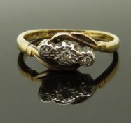 A 9ct gold ring set with three diamonds in a platinum setting, size M/N, 2.41g