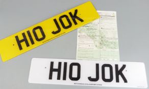 Car registration number H10 JOK on retention, with a pair of number plates