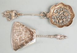 Dutch white metal sifter spoon with 1928 Dutch silver marks,together with a caddy spoon with 1924