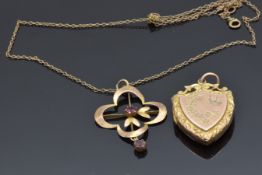 Victorian 9ct gold shield shaped locket with engraved swallow and floral decoration and a 9ct gold