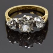 An 18ct gold ring set with three old cut diamonds measuring approximately 0.83, 0.2 & 0.2cts, size