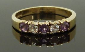 A 9ct gold ring set with amethysts and cubic zirconia, size N, 2.26g