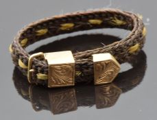 Victorian plaited hair mourning ring with gold buckle decoration