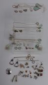 A collection of silver jewellery including earrings, a quantity of new silver necklaces and rings