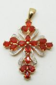 A 9ct gold pendant set with pear cut Mexican fire opals and diamonds, 6.2g