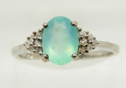 A 9ct white gold ring set with an oval cut Paraiba opal and diamonds, 1.9g, size N