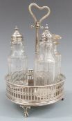 Georgian hallmarked silver mounted cruet stand with pierced decoration and raised on three feet,