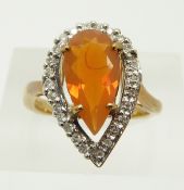 A 9ct gold ring set with a pear cut fire opal and diamonds, 4.4g, size N