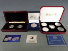 Three Pobjoy Mint cased silver coin sets comprising a proof 25th Anniversary of Liberation, a