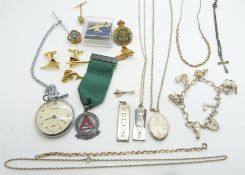 A collection of silver jewellery including charm bracelet, necklace, bracelet, locket, two ingots,
