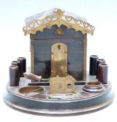 19th/early 20thC cigar box in the form of a house with cigar cutter to front, on circular base, 15cm