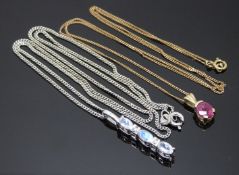 A 9ct white gold pendant set with moonstones and diamonds and a 9ct gold pendant set with a ruby,