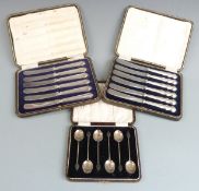 Cased set of hallmarked silver coffee bean spoons and two cased sets of hallmarked silver handled