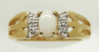 A 9ct gold ring set with an oval opal cabochon and diamonds, 2.9g, size N