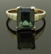 A 9ct gold ring set with an emerald cut topaz, size N/O, 3.47g