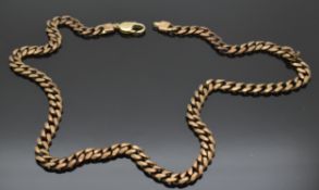 A large 9ct gold curb link necklace, 67.1g