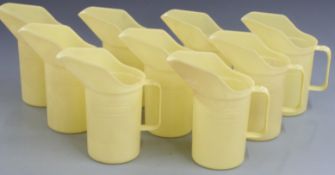 Nine Duckhams oil jugs, height 21cm
