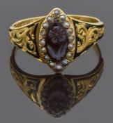 Victorian 18ct gold ring set with a carved agate flower surrounded by seed pearls with foliate and