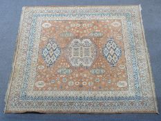 A large Turkoman rug on brown ground with four geometric borders, 220 x 250cm