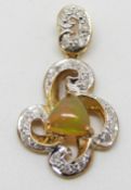 A 9ct gold pendant set with an opal cabochon and diamonds, 3.3g