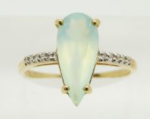 An 18ct gold ring set with a pear cut Paraiba opal and diamonds, 2.4g, size N