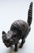 Cold painted bronze model of a startled cat, 5.5cm tall.